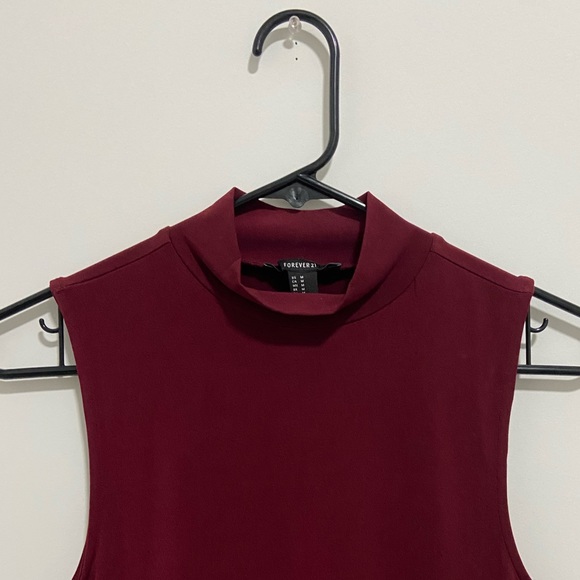 It’s a beautiful body on dress in deep red.It hugs the body pretty well. - Picture 3 of 3